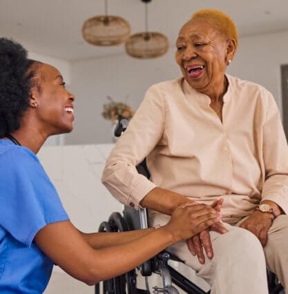 caretaker and elderly man talking