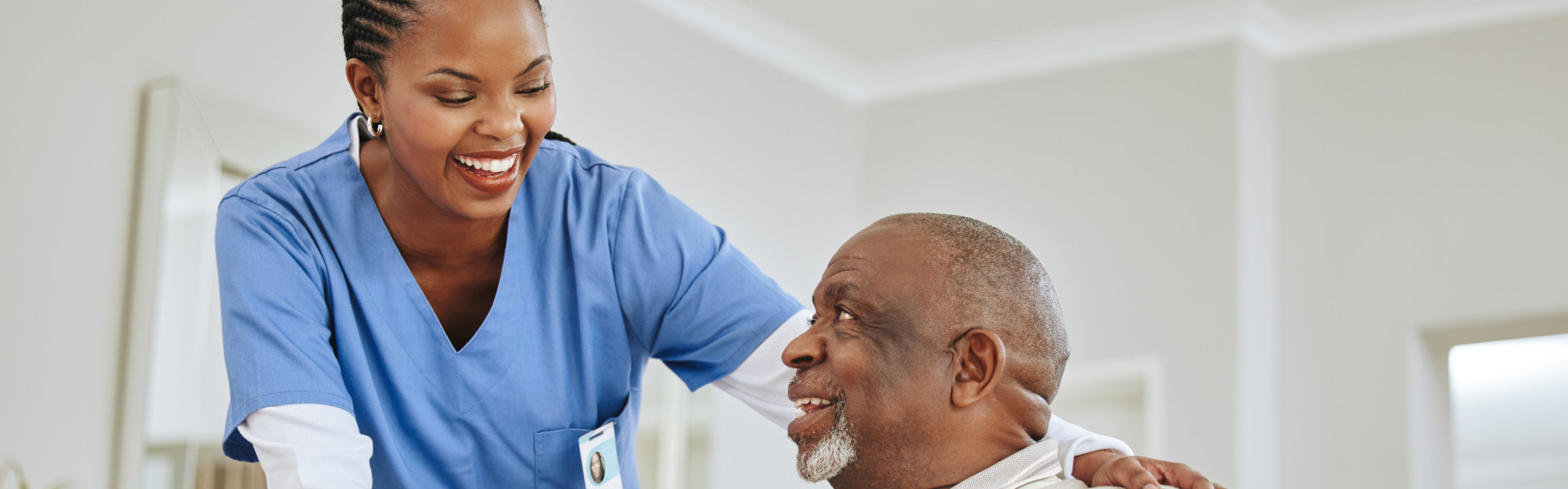 a nurse speaking to her male patient
